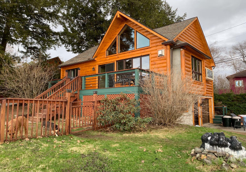 What is the difference between a log home and a timber frame home?
